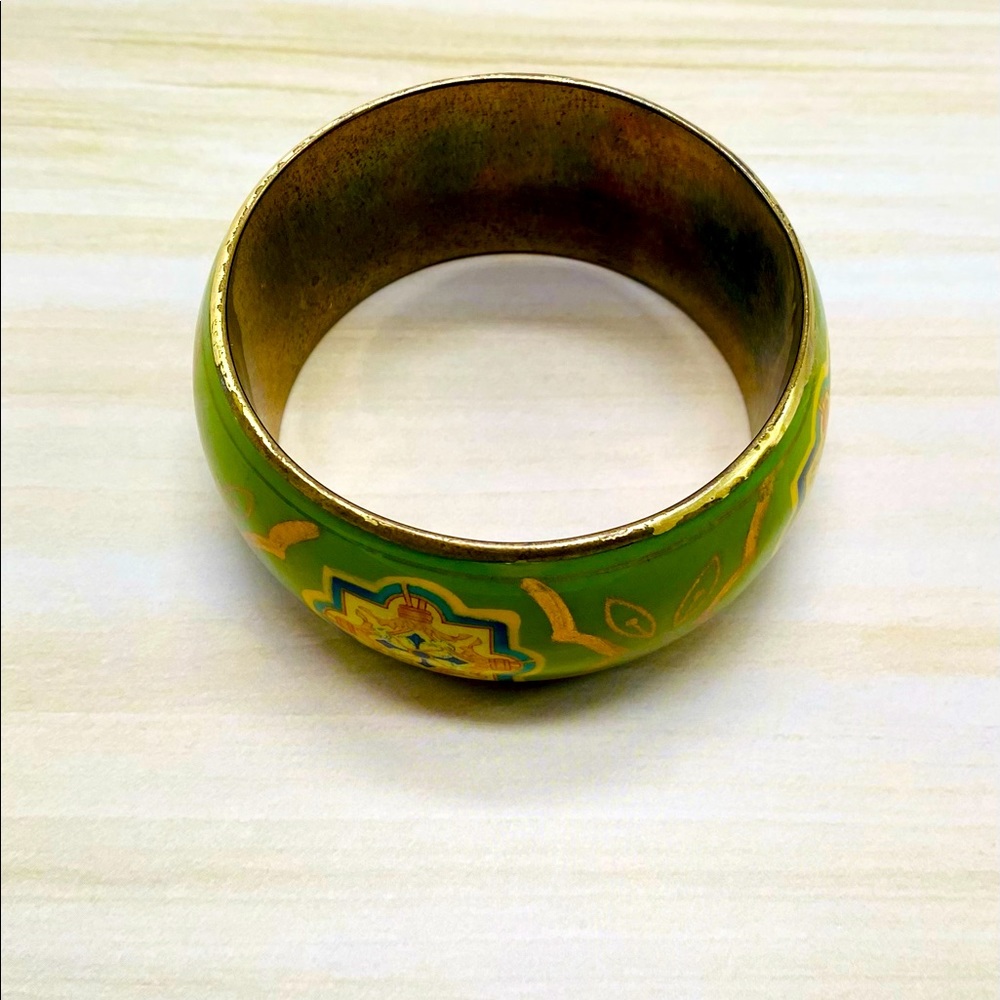 Green color bangle has a few scratches